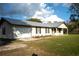 House exterior with attached garage and landscaping at 4915 Mount Pleasant Rd, Groveland, FL 34736