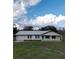 Single story house with metal roof and front porch at 4915 Mount Pleasant Rd, Groveland, FL 34736