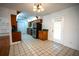 Kitchen with wood cabinets, tiled floors and stainless steel appliances at 4915 Mount Pleasant Rd, Groveland, FL 34736