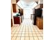 Kitchen with wood cabinets, green countertops, and tile floors at 4915 Mount Pleasant Rd, Groveland, FL 34736