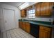 Kitchen with wood cabinets, granite countertops, and stainless steel appliances at 4915 Mount Pleasant Rd, Groveland, FL 34736