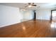 Large living area with wood-look floors and access to dining area at 4915 Mount Pleasant Rd, Groveland, FL 34736