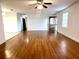 Spacious living room with wood-look floors and ceiling fan at 4915 Mount Pleasant Rd, Groveland, FL 34736