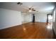 Living room boasts hardwood floors and a ceiling fan at 4915 Mount Pleasant Rd, Groveland, FL 34736