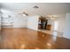 Spacious living room with hardwood floors and built-in shelving at 4915 Mount Pleasant Rd, Groveland, FL 34736