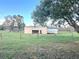 Metal building with large doors and grassy area at 4915 Mount Pleasant Rd, Groveland, FL 34736