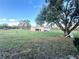 Tan metal workshop building in a spacious backyard at 4915 Mount Pleasant Rd, Groveland, FL 34736