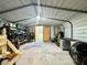 Well-lit workshop with shelving and tools for various tasks at 4915 Mount Pleasant Rd, Groveland, FL 34736