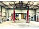 Well-lit workshop with two lifts and storage at 4915 Mount Pleasant Rd, Groveland, FL 34736