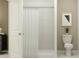 Bathroom with shower/tub combo, white toilet, and white vanity at 862 Hour Glass Rd, Lakeland, FL 33801