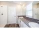 Bathroom with double vanity, gray countertop, and walk-in shower at 1106 Foreshore Ln, Haines City, FL 33844