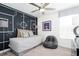 Bedroom with a soccer-themed wall and a daybed at 5657 Meditation Dr, Clermont, FL 34714