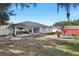 Large backyard with covered patio and shed at 3805 Sw 115Th St, Ocala, FL 34476