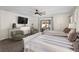Spacious bedroom with two beds, a TV, and sliding glass doors to patio at 3805 Sw 115Th St, Ocala, FL 34476