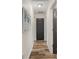Bright hallway with wood-look tile flooring and neutral walls at 3805 Sw 115Th St, Ocala, FL 34476