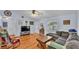 Spacious living room with hardwood floors and comfy seating at 136 Cory Ct, Auburndale, FL 33823