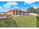 Landscaped backyard with spacious patio and fire pit at 1771 Turtle Rock Dr, Lakeland, FL 33803