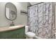 Clean and updated bathroom with a green vanity and neutral decor at 1771 Turtle Rock Dr, Lakeland, FL 33803
