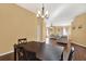 Spacious dining room with hardwood floors and a view to the living area at 1771 Turtle Rock Dr, Lakeland, FL 33803