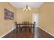 Charming dining room with hardwood floors, chandelier, and seating for four at 1771 Turtle Rock Dr, Lakeland, FL 33803
