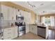 Modern kitchen with granite countertops, stainless steel appliances, and white cabinets at 1771 Turtle Rock Dr, Lakeland, FL 33803