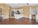 Modern kitchen with white cabinets, granite countertops, and stainless steel appliances at 1771 Turtle Rock Dr, Lakeland, FL 33803