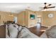 Open concept living room with hardwood floors and access to the dining area at 1771 Turtle Rock Dr, Lakeland, FL 33803