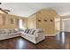 Large living room with hardwood floors, neutral walls, and a comfy sectional sofa at 1771 Turtle Rock Dr, Lakeland, FL 33803