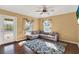 Living room with L-shaped sofa and wood floors at 1771 Turtle Rock Dr, Lakeland, FL 33803