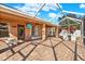 Large patio with screened enclosure, brick pavers and outdoor furniture at 1771 Turtle Rock Dr, Lakeland, FL 33803