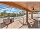 Spacious screened-in patio with brick pavers and outdoor seating at 1771 Turtle Rock Dr, Lakeland, FL 33803
