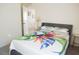 Bedroom with a bed and access to another room at 4694 Sigcom Pl, Wildwood, FL 34785