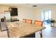 Granite countertop kitchen island with stainless steel sink and modern appliances at 4694 Sigcom Pl, Wildwood, FL 34785