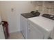 Bright laundry room with washer and dryer at 4694 Sigcom Pl, Wildwood, FL 34785