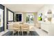 Dining area and living room with neutral tones and natural light at 838 Hour Glass Rd, Lakeland, FL 33801