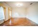 Bright living room with hardwood floors and large windows at 5325 Charlin Ave, Lakeland, FL 33810