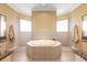 Spa-like bathroom with a large soaking tub and walk-in shower at 5508 Pebble Beach Dr, Lakeland, FL 33812