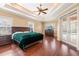 Spacious main bedroom with hardwood floors and private access to the pool at 5508 Pebble Beach Dr, Lakeland, FL 33812