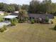 Aerial view of house and landscape at 6085 Amaryllis Dr, Indian Lake Estates, FL 33855