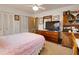 Bedroom with double bed, dresser, and tv at 6085 Amaryllis Dr, Indian Lake Estates, FL 33855
