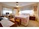 Bedroom with double bed, desk, and dresser at 6085 Amaryllis Dr, Indian Lake Estates, FL 33855