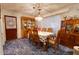 Classic dining room with wooden table and chairs, and built-in hutch at 6085 Amaryllis Dr, Indian Lake Estates, FL 33855