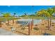 Circular fountain with palm trees and landscaping at 6085 Amaryllis Dr, Indian Lake Estates, FL 33855