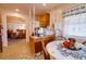 Kitchen boasts a breakfast nook and views into the dining area at 6085 Amaryllis Dr, Indian Lake Estates, FL 33855