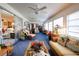 Bright sunroom, featuring wicker furniture and sliding glass doors at 6085 Amaryllis Dr, Indian Lake Estates, FL 33855