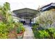Covered patio workshop with storage at 6085 Amaryllis Dr, Indian Lake Estates, FL 33855