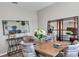 Bright dining room with a wood table, gray chairs, and large mirror at 3129 Zuni Rd, St Cloud, FL 34771
