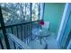 Private screened balcony with table and chairs at 606 Gran Bahama Boulevard # 29-606, Davenport, FL 33897