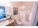 Clean bathroom with tub shower, toilet and vanity at 606 Gran Bahama Boulevard # 29-606, Davenport, FL 33897