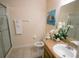 Bathroom with shower, toilet and a vanity with a mirror at 606 Gran Bahama Boulevard # 29-606, Davenport, FL 33897